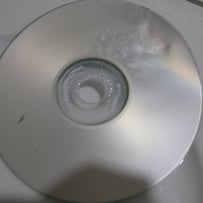 A close up of a cd

AI-generated content may be incorrect.