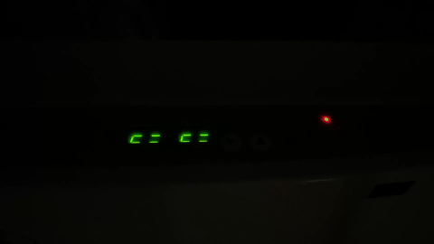 A black device with green lights

AI-generated content may be incorrect.