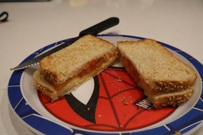 A sandwich cut in half on a plate

AI-generated content may be incorrect.