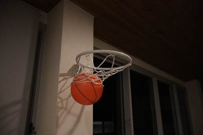 A basketball in a hoop

AI-generated content may be incorrect.